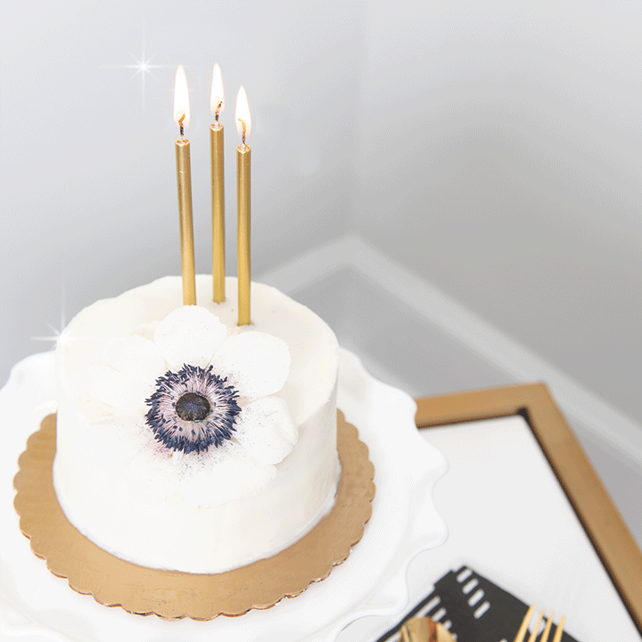 Cake with flower and gif of candles lighting up