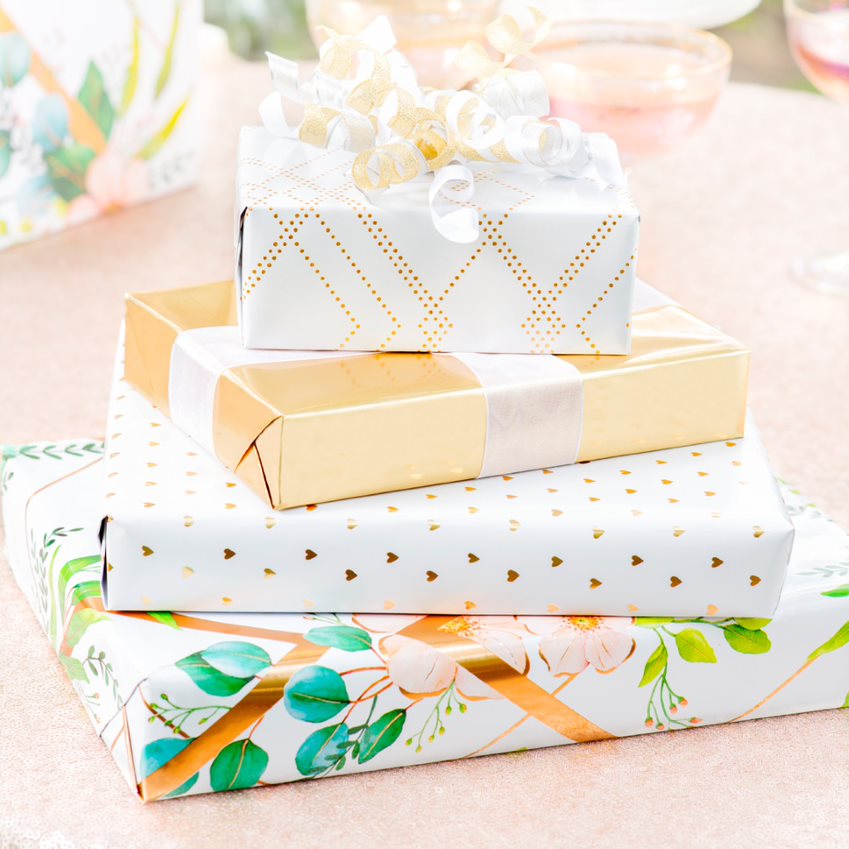 White and gold wrapped present on table